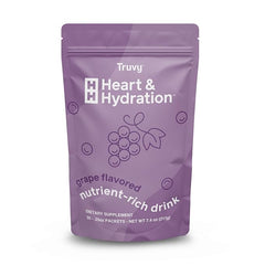 Glass of grape-flavored Truvy Heart & Hydration served cold.