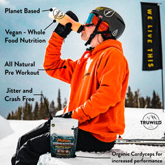 TruWild Motion scoop beside tub enables precise pre-workout dosing
