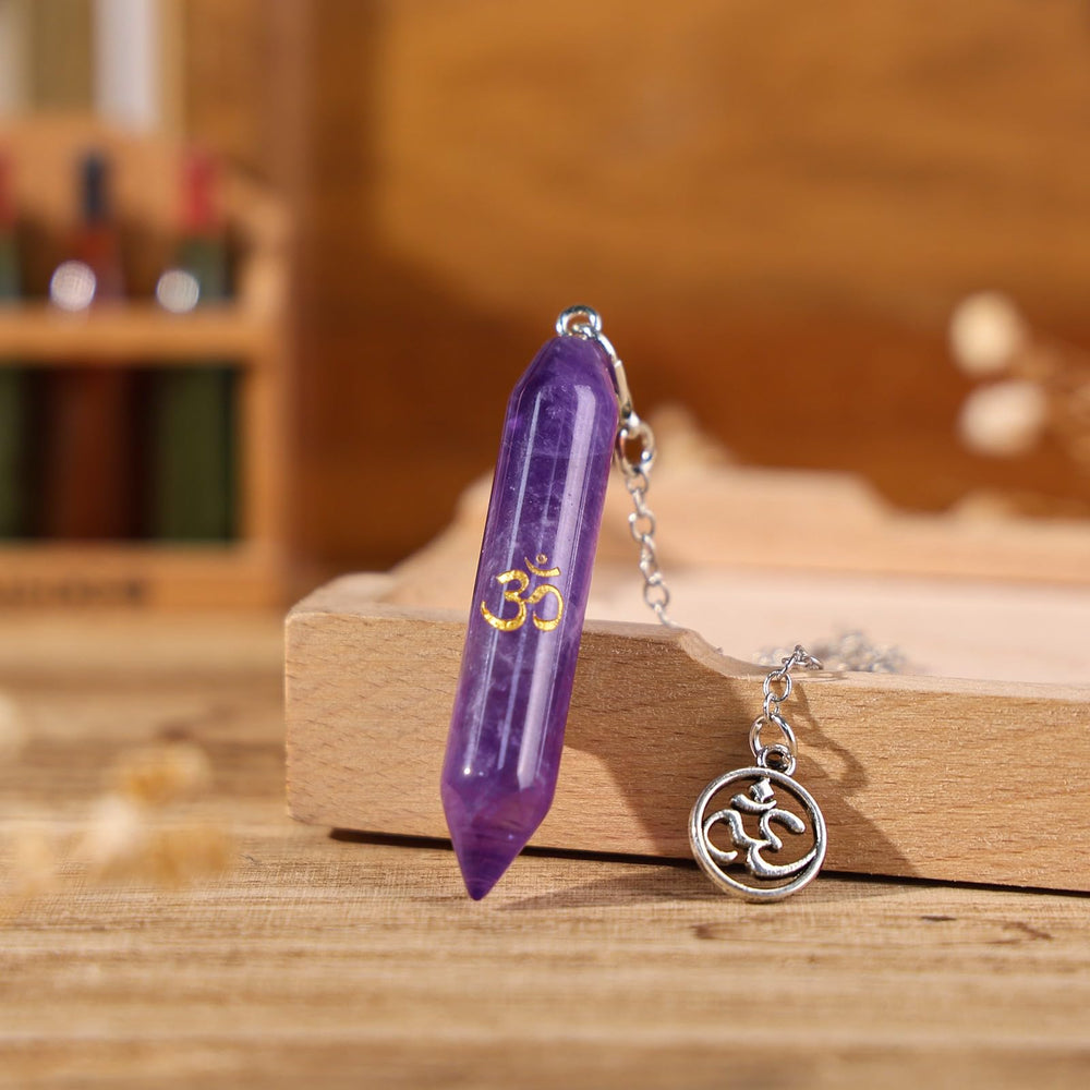 TUMBEELLUWA amethyst pendulum in hand for focused readings