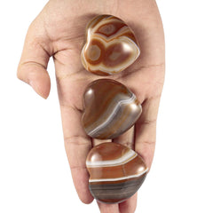 TUMBEELLUWA carneli an palm stone promotes confidence and creative energy during practice.