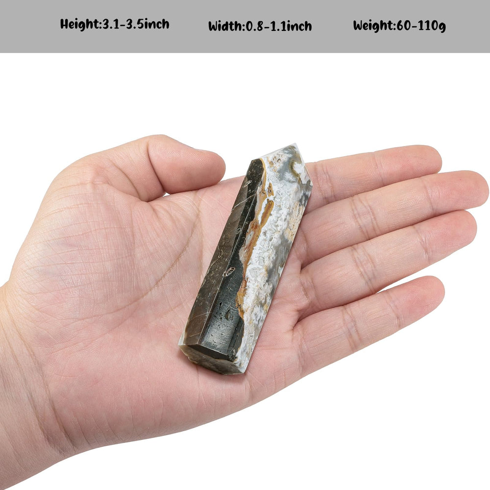 TUMBEELLUWA crystal wand with pointed tip used for energy focus in rituals.