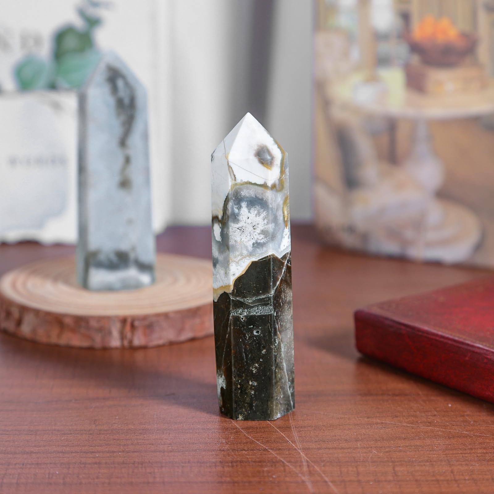 TUMBEELLUWA natural crystal obelisk showing surface texture and color variation.