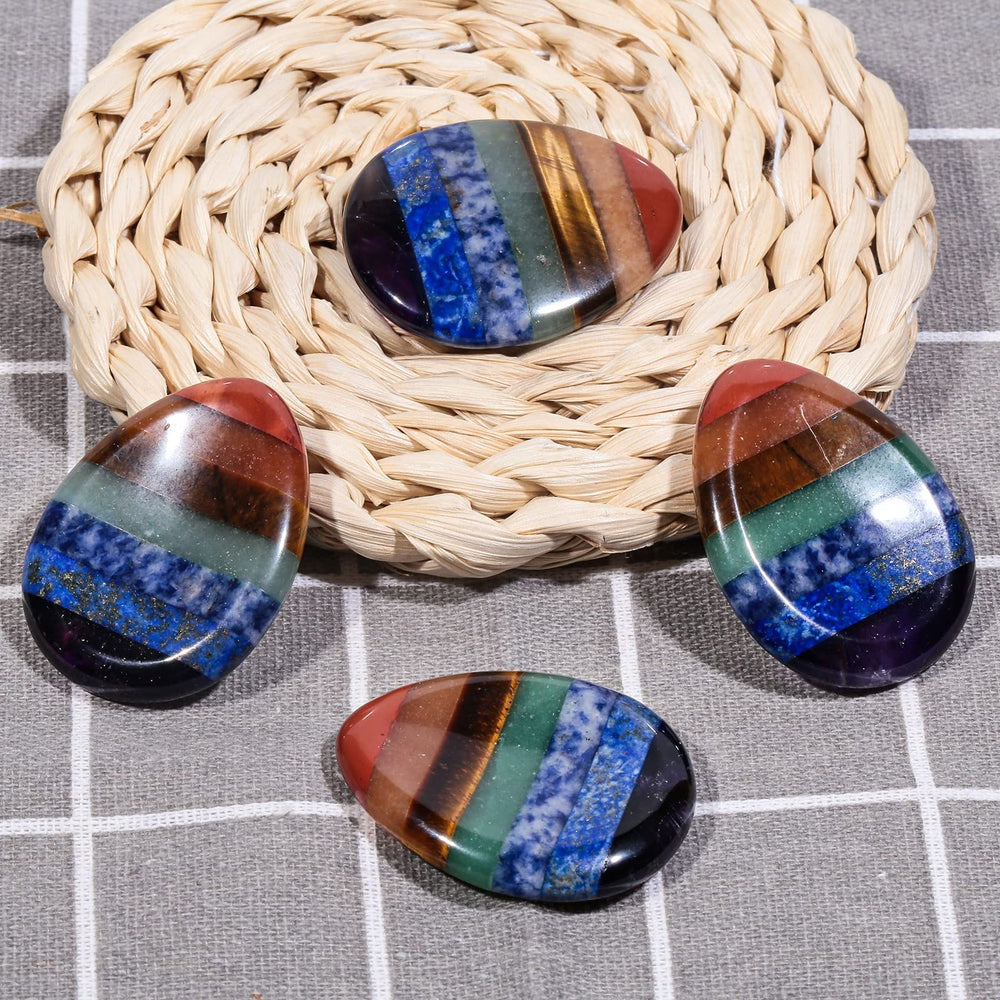 TUMBEELLUWA red jasper worry stone close-up for stress relief and mood boost.