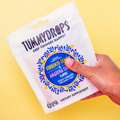 Tummydrops peppermint oil drop illustration conveys refreshing mint flavor.