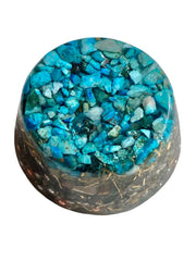 Turquoise Single Crystal Tower Buster Orgone Generator on a desk for calm ambience.