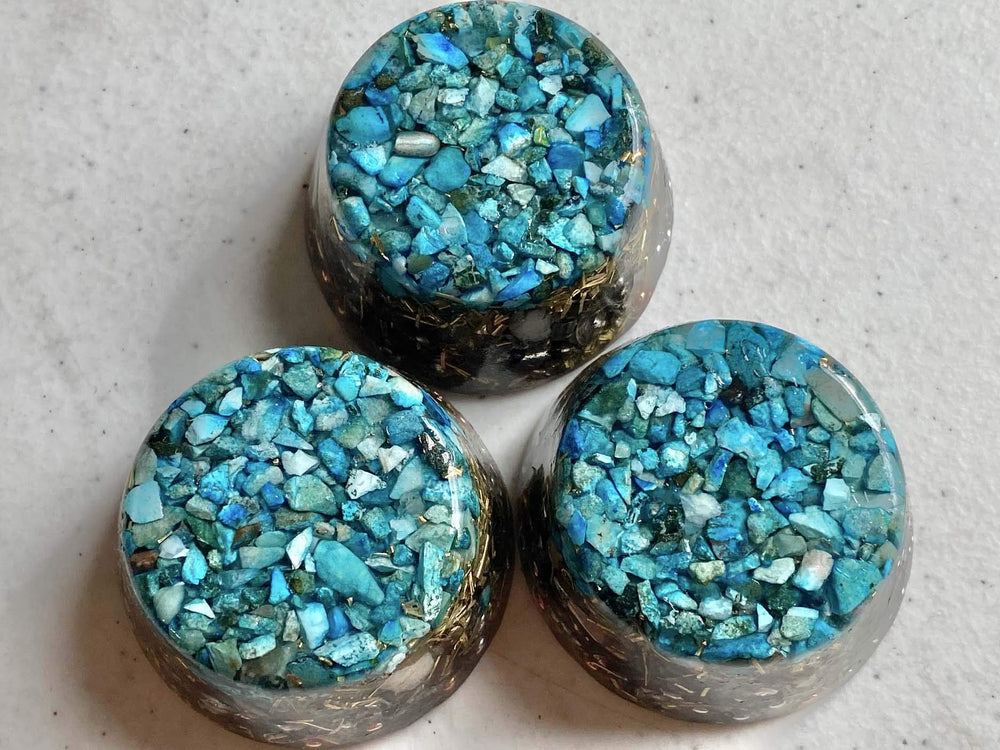 Turquoise Single Crystal Tower Buster Orgone Generator adds color and texture to decor.