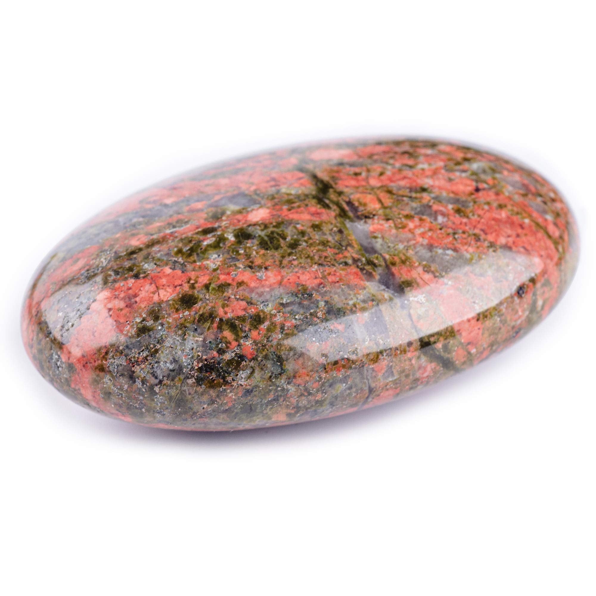 Unakite palm stone held in hand during meditation for focus and presence.