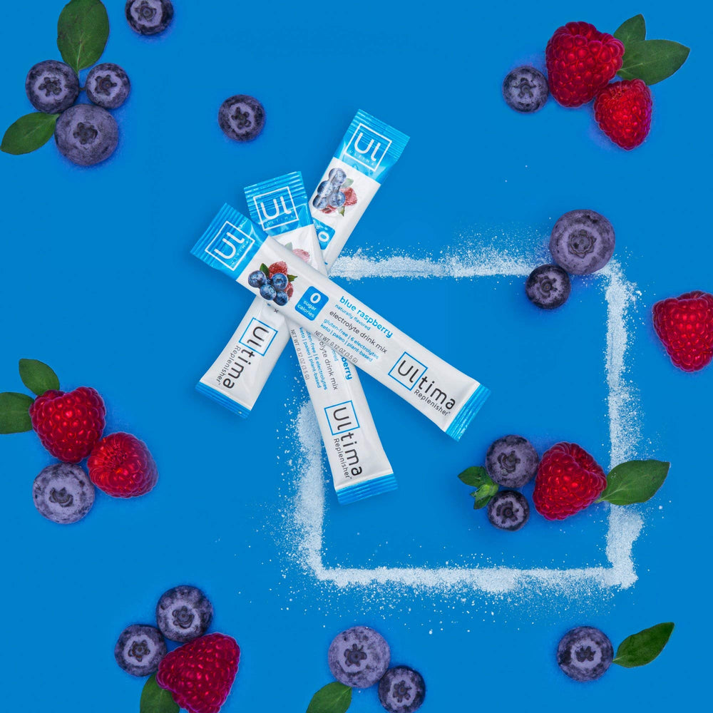 Ultima Replenisher blue raspberry powder dissolving in water