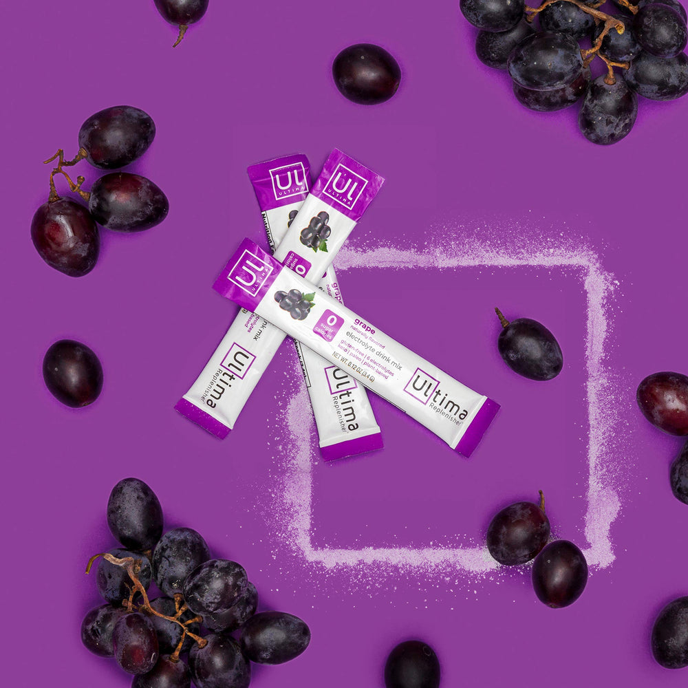 Ultima Replenisher grape dissolving in water captures quick electrolyte refreshment.