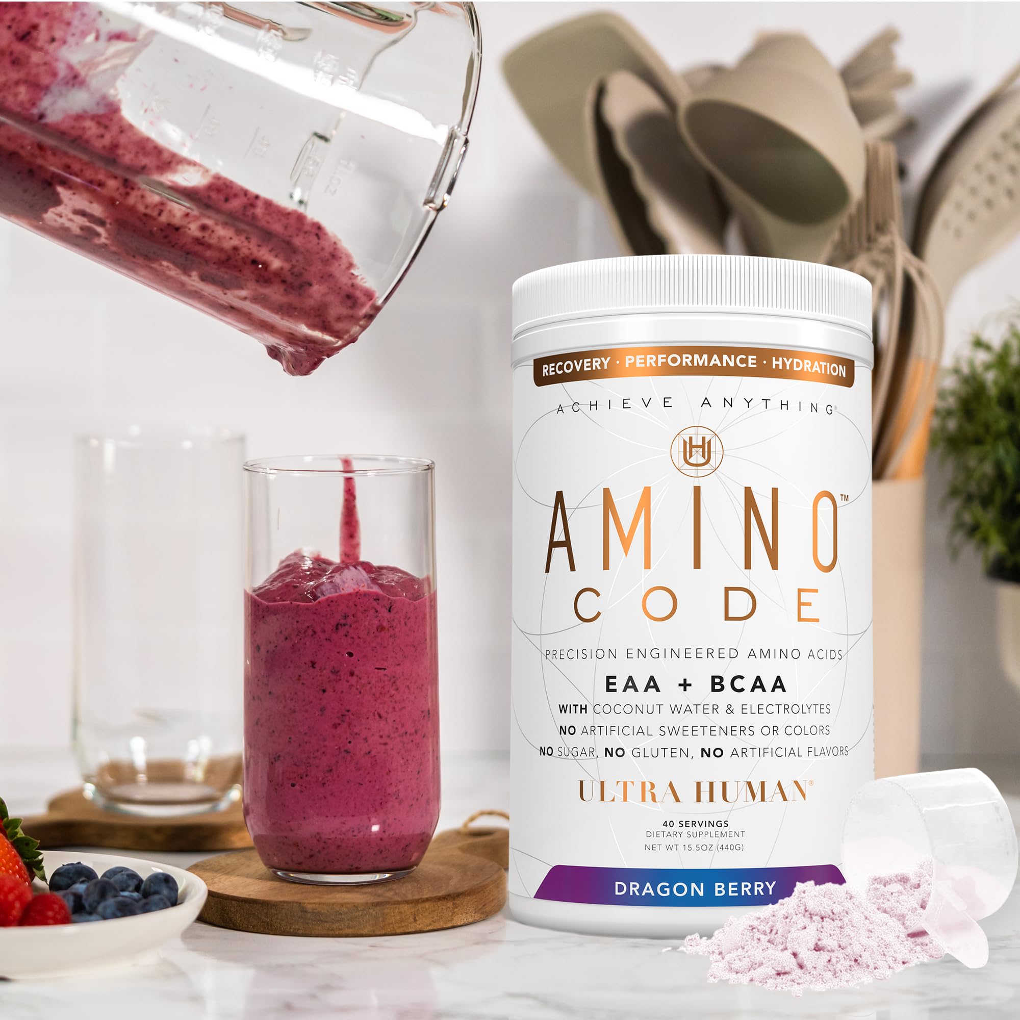 Athlete drinking Ultra Human Amino Code Dragonberry during workout session.
