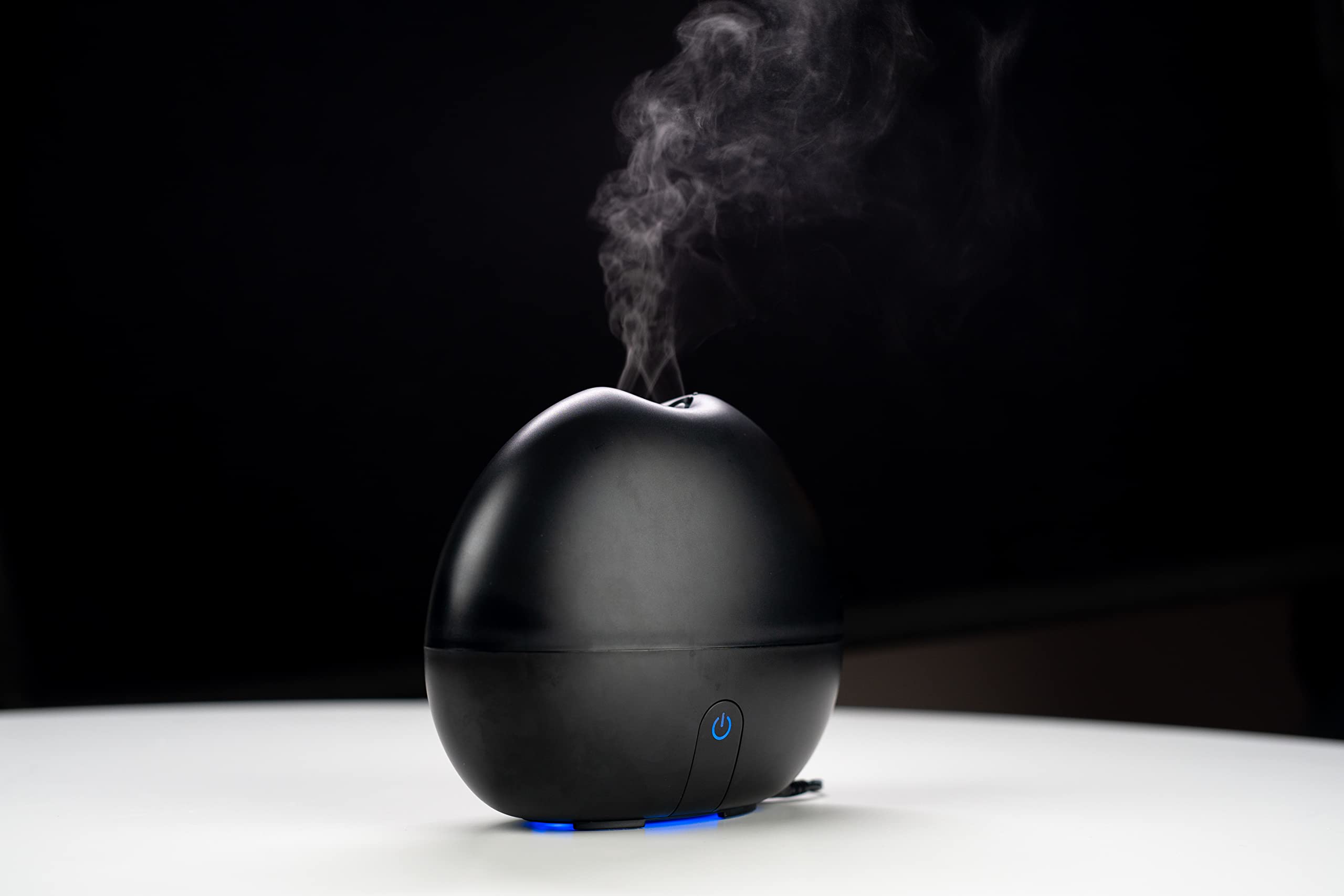 Ultransmit ipple humidifier and aroma diffuser placed on a living room table.