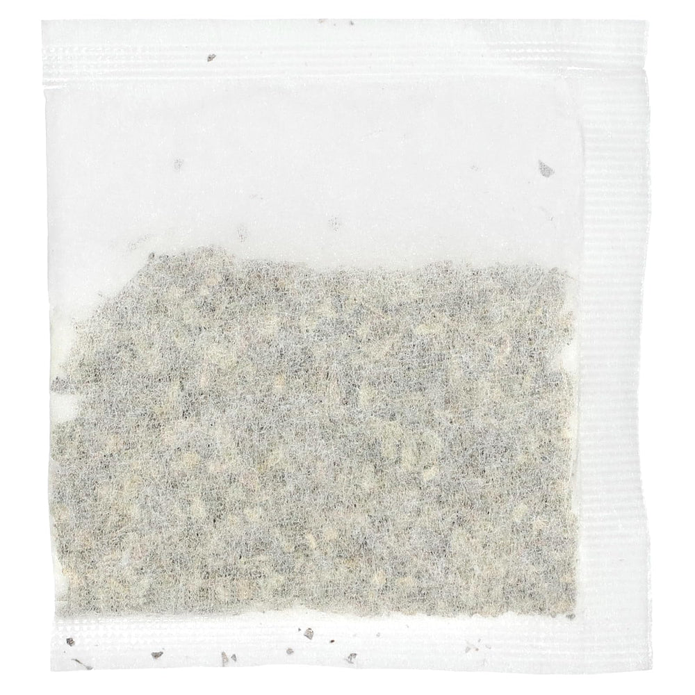 Uncle Lee's Tea Dieters in cup steeping, releasing fragrant herbal notes.
