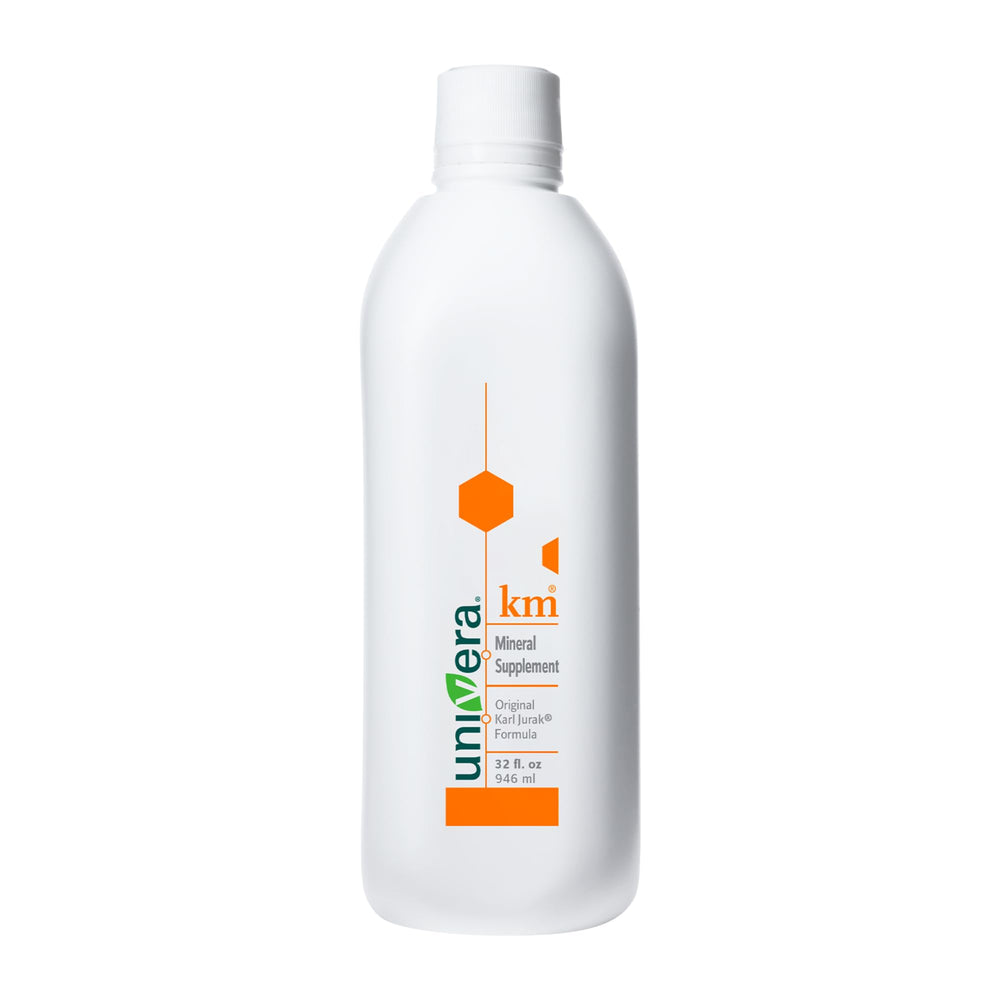 Univera km bottle being poured for convenient daily potassium support