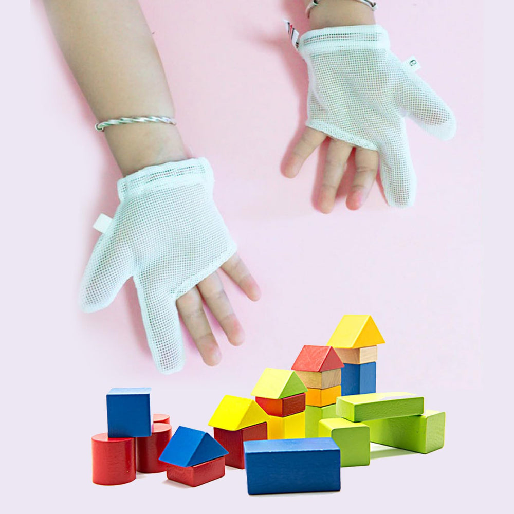 UOMIO thumb sucking guard on a child's hand during playtime.