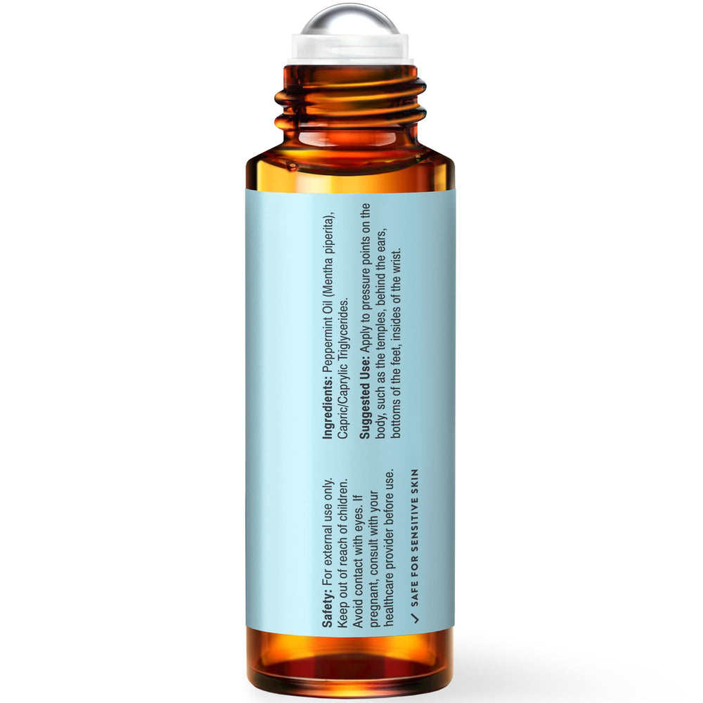 Fresh peppermint leaves beside UpNature Roll-On to signify natural origin