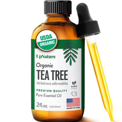 UpNature Tea Tree Oil bottle being poured for versatile skincare and haircare.