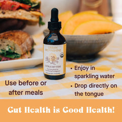 Urban Moonshine Citrus Digestive Bitters with citrus slices signals refreshing flavor notes