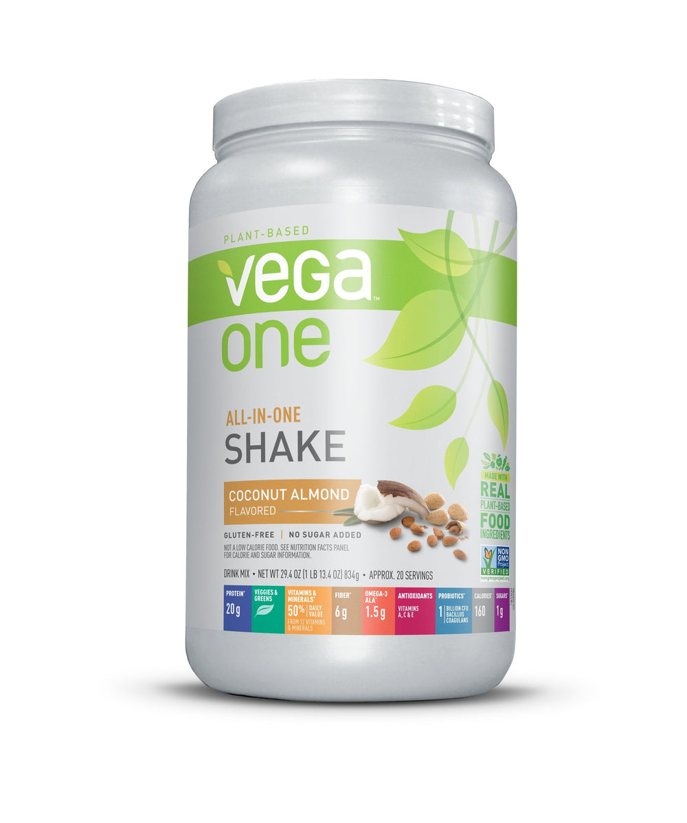 Vega One Coconut Almond tub closeup highlights plant-based protein and greens for daily nutrition.