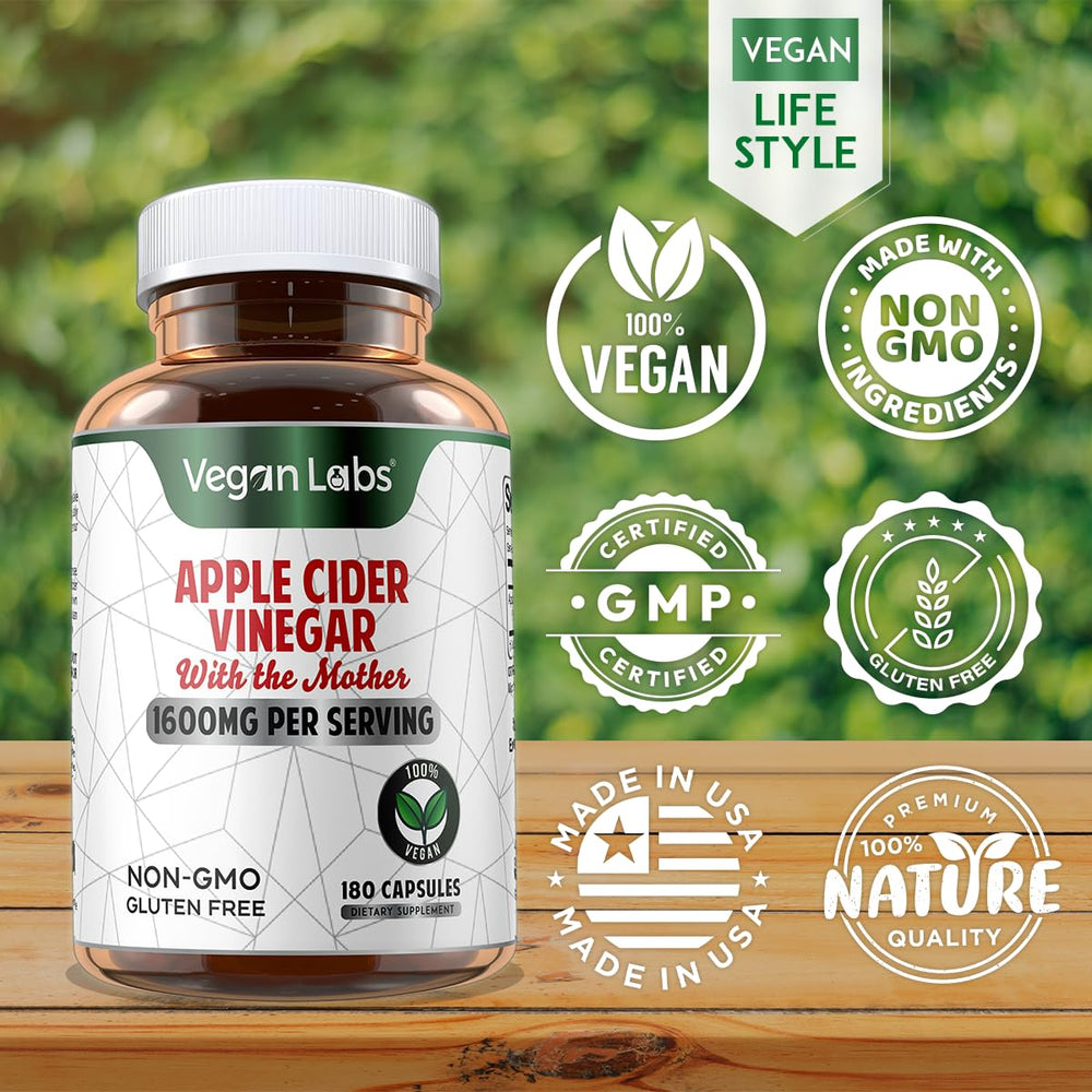Glass of water beside Vegan Labs ACV capsules for easy intake.