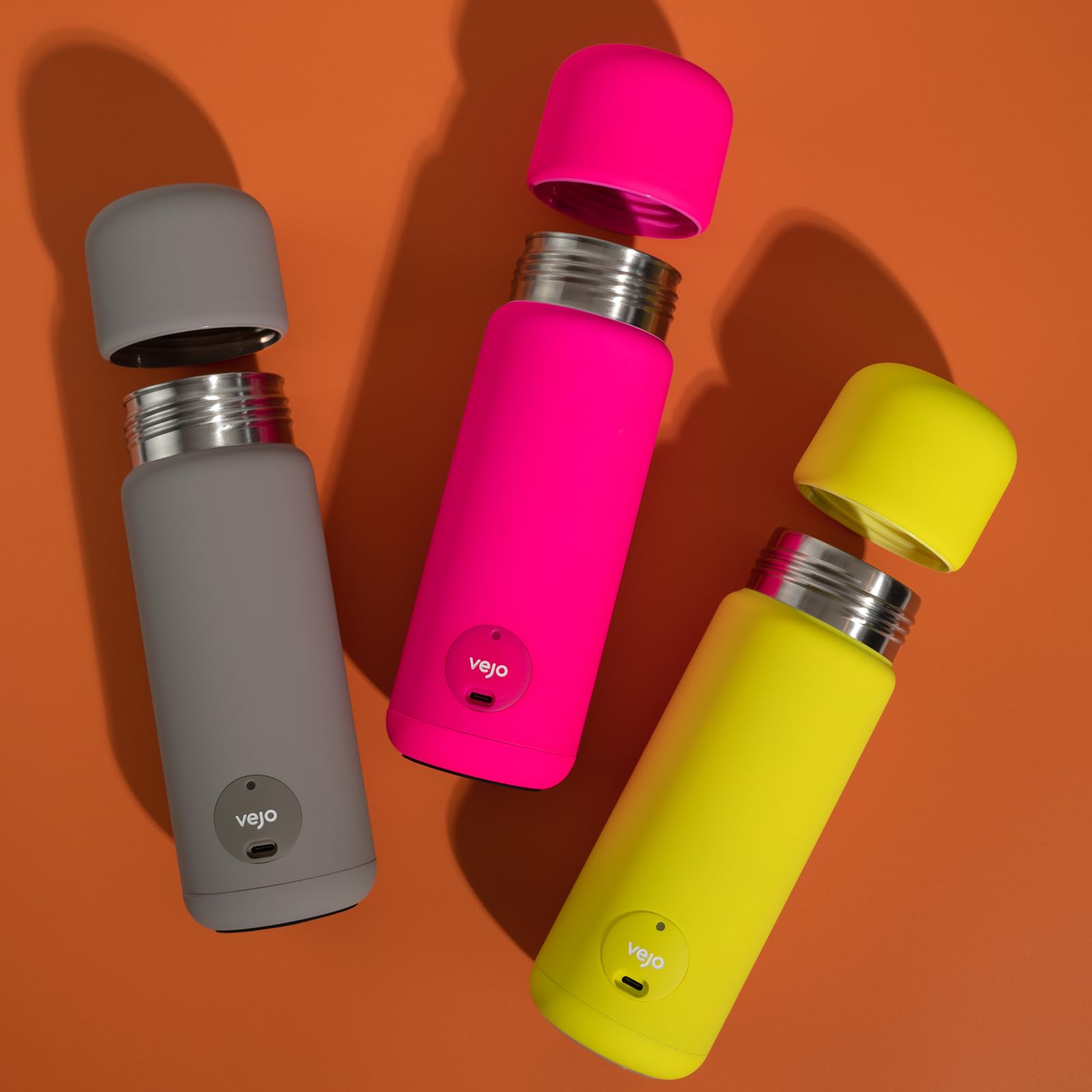 Vejo travel-friendly shaker beside a cup holder in a gym setting.
