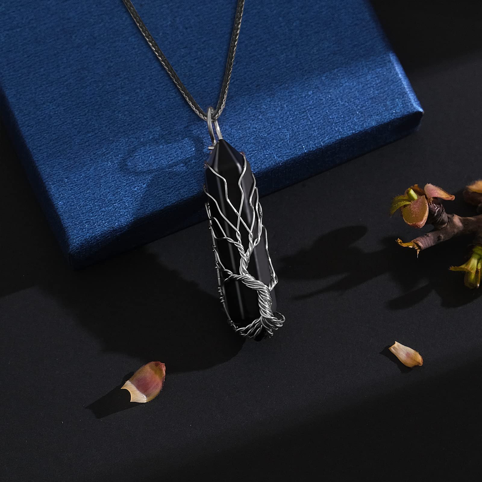VIBILIA tree of life pendant wire-wrap detail emphasizing growth and renewal symbolism.