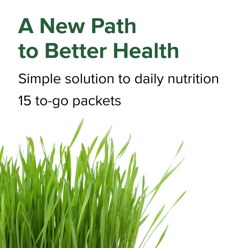 Vibrant Health Green Vibrance stirred into juice for quick, nutrient-dense refreshment.