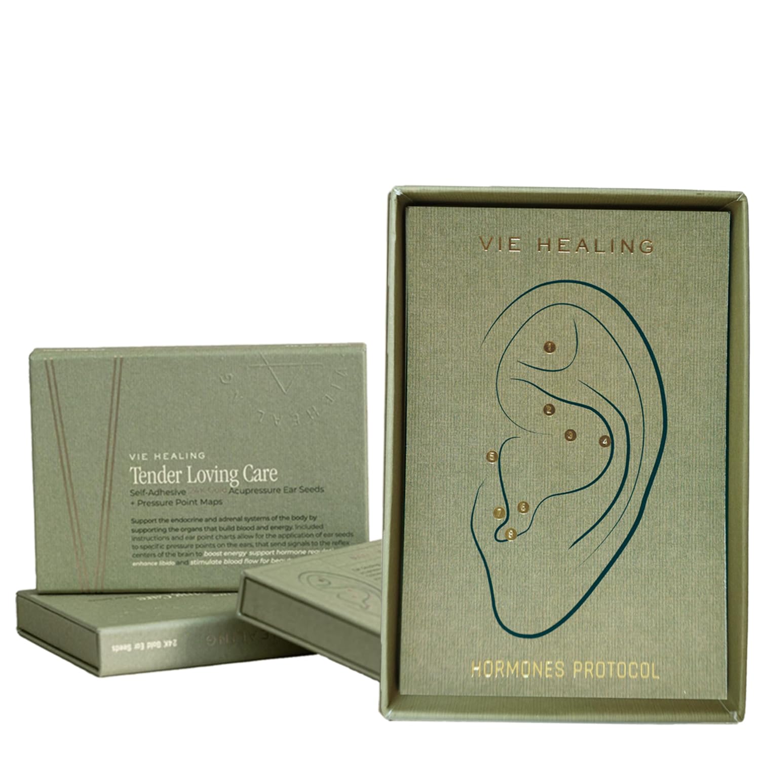 Vie Healing 24K ear seeds closeup for premium auriculotherapy in a luxury self-care routine