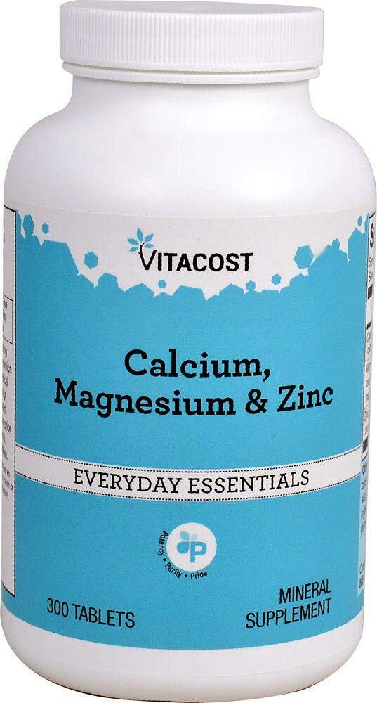Vitacost Calcium, Magnesium & Zinc bottle pour showing daily mineral support