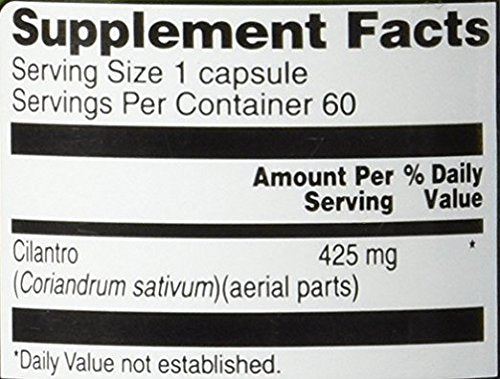 Close-up of Vitacost Cilantro capsules shows compact, easy-to-swallow form.