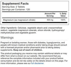 Close-up of Vitacost Magnesium Citrate tablets; supports nerve function and protein production.