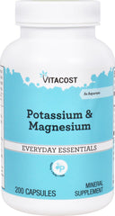 Vitacost Potassium & Magnesium bottle on desk for daily mineral support and convenience.