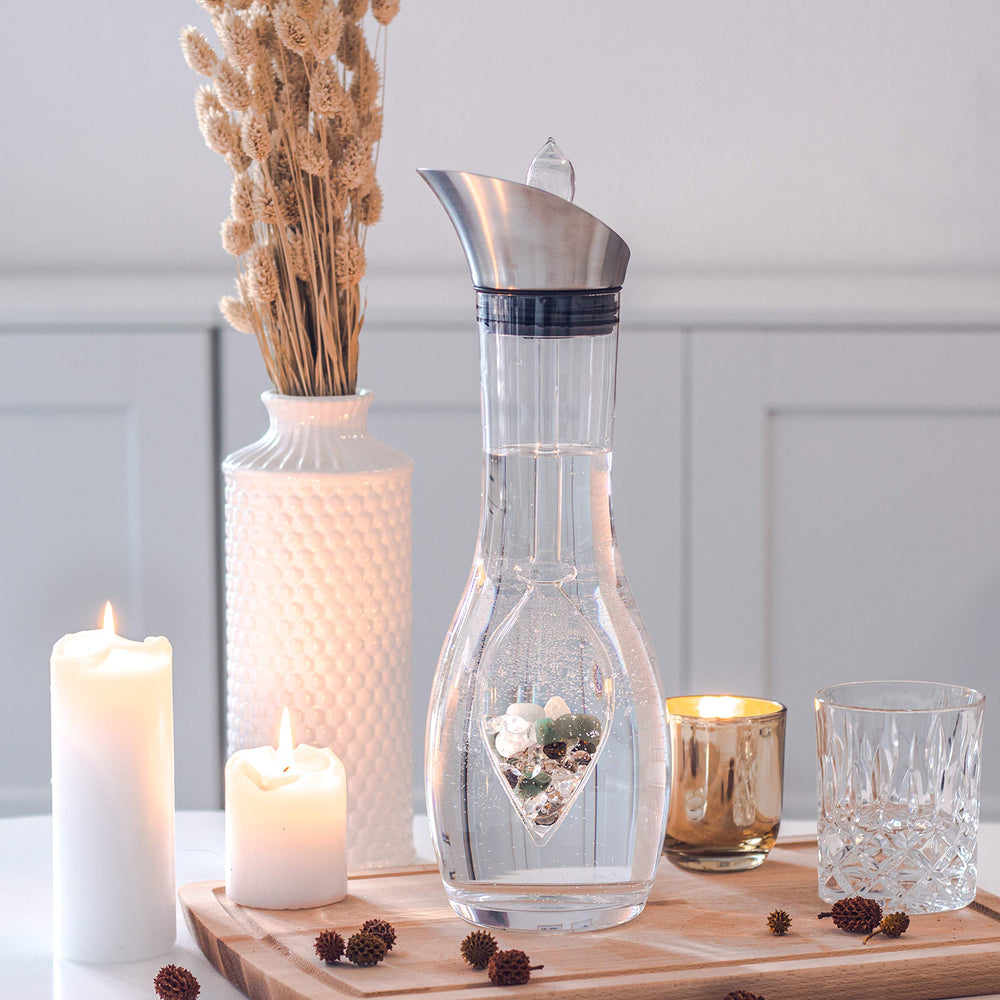 VitaJuwel Era Forever Young carafe on a home desk for daily hydration.