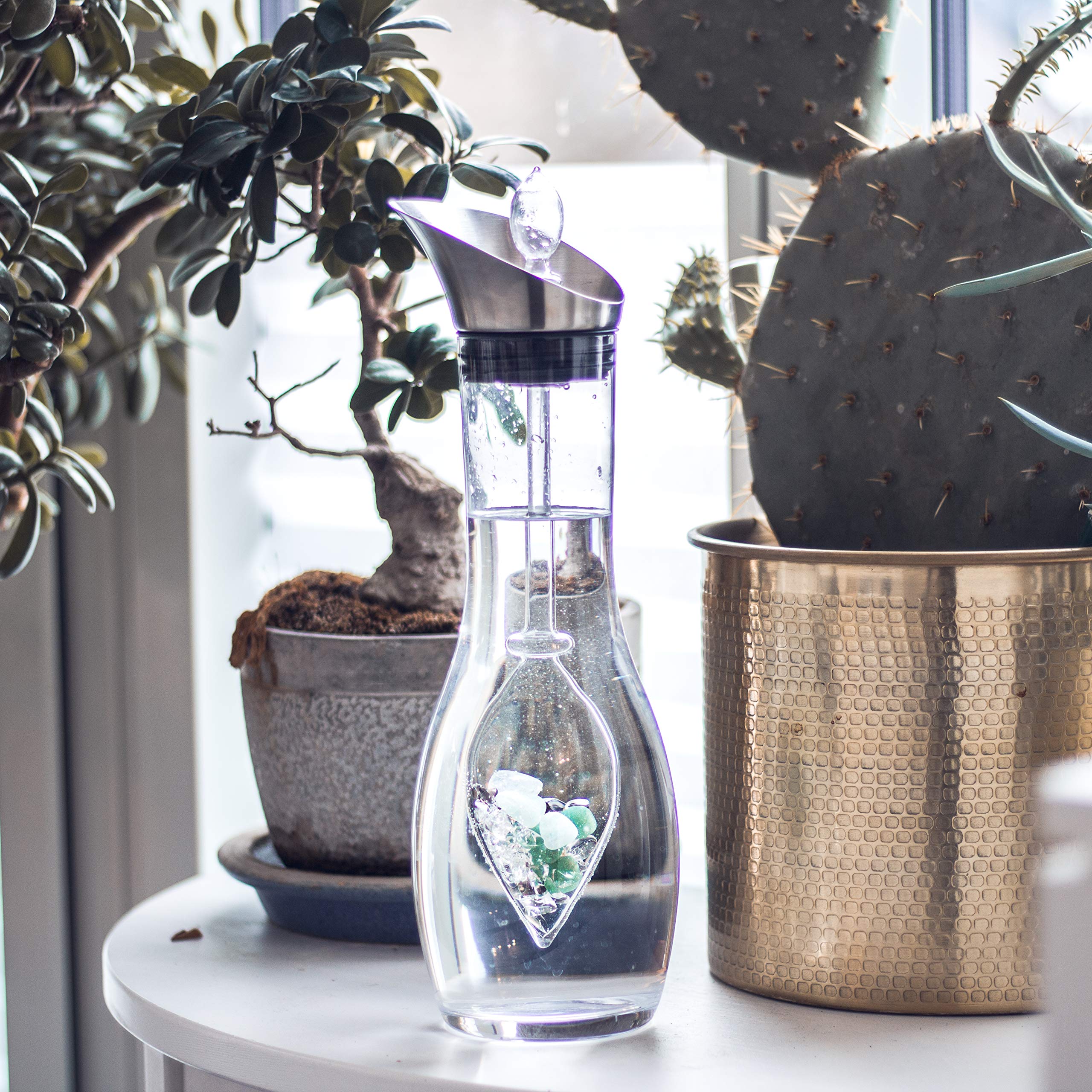 VitaJuwel Era Forever Young carafe with a sleek stainless steel lid for modern pouring.
