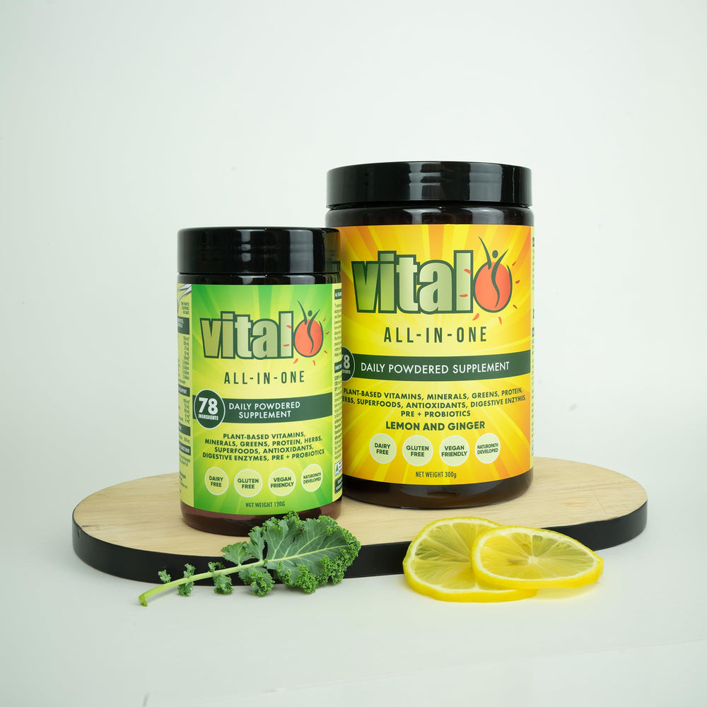 Vital All-In-One scoop beside shaker ready for quick mixing.