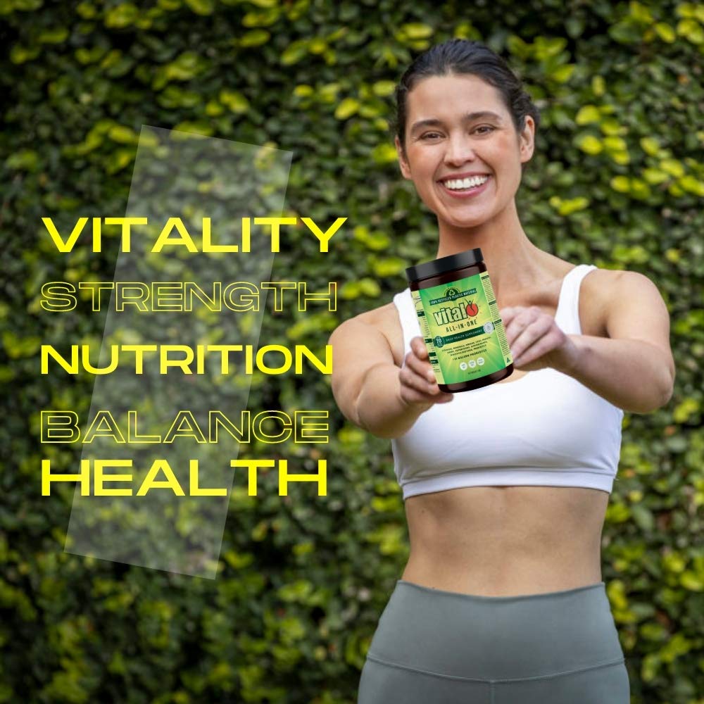 Vital Greens powder being stirred into water for a plant-based multivitamin boost