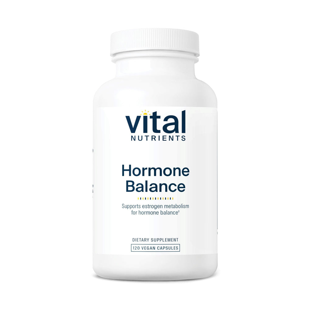 Vital Nutrients Hormone Balance bottle on wood table showing hormone metabolism support