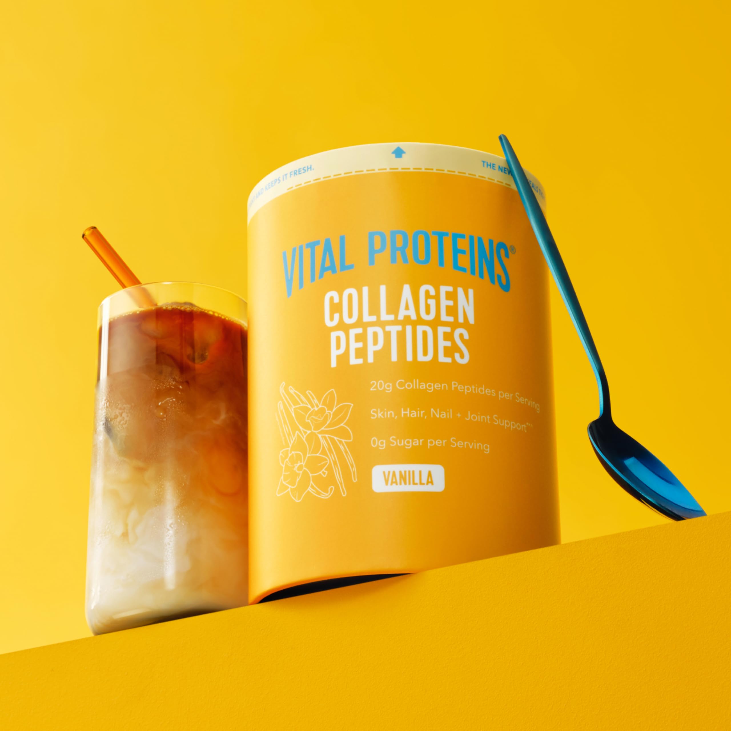 Vital Proteins Collagen Peptides Vanilla tub with scoop for easy mix into coffee.