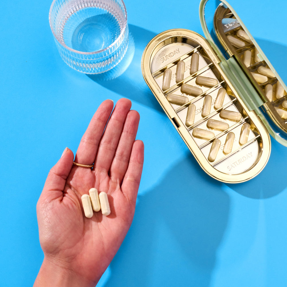 Vital Proteins colostrum capsules on morning routine tray.