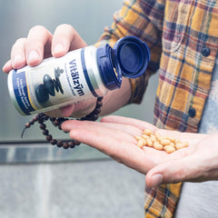 VITÄLZYM vegetarian formula highlighting absence of gluten, dairy, and yeast.