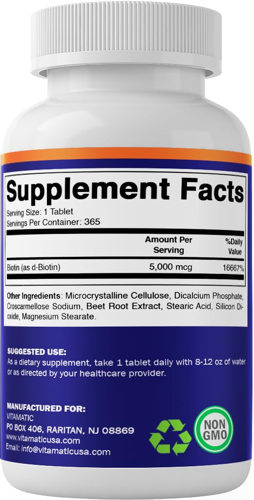 Vitamatic Biotin 5000mcg tablets held for size reference.