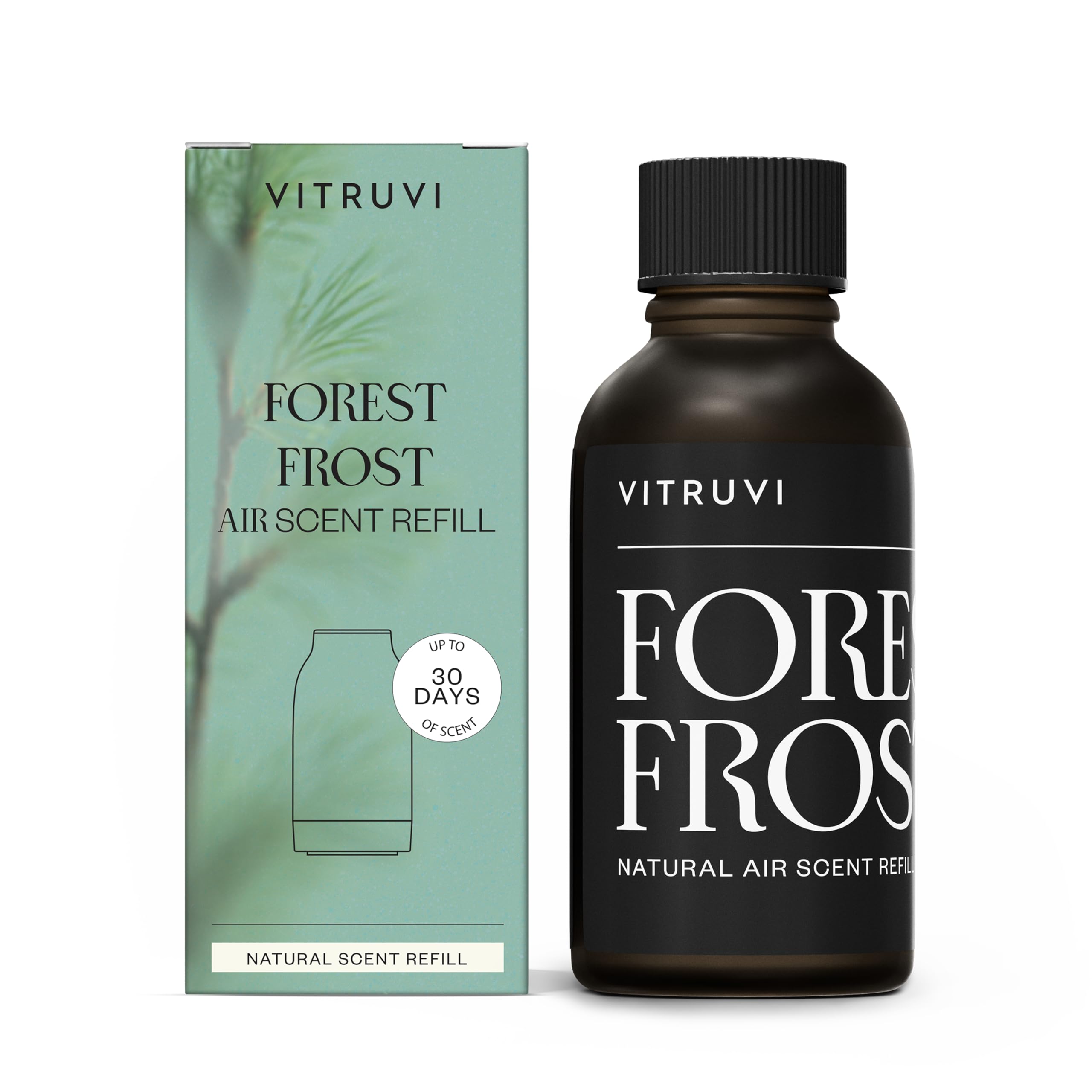 Vitruvi Forest Frost refill bottle close-up showing woodsy Fir, Cedarwood and Pine scent for calm spaces.