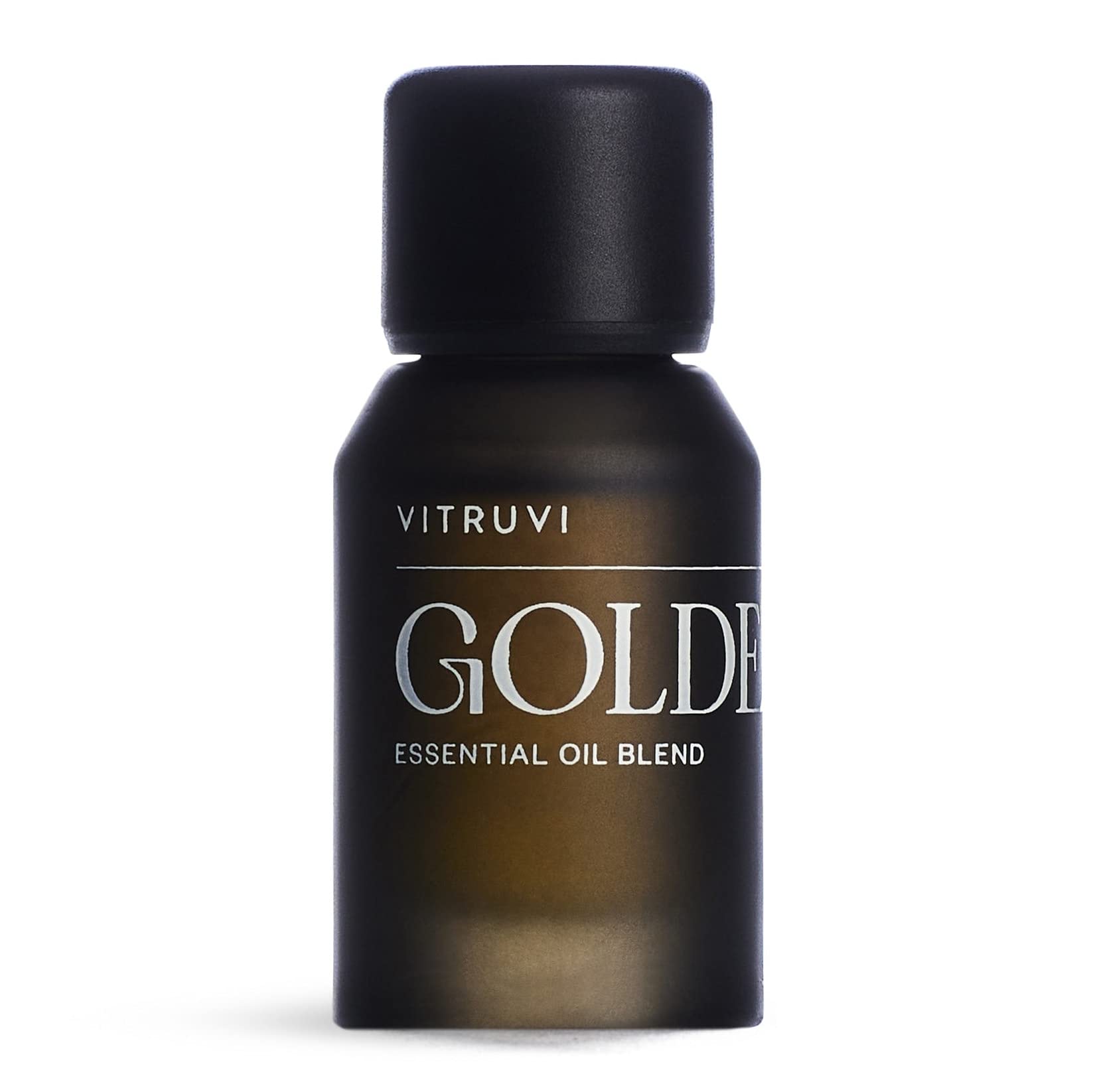 Vitruvi Golden bottle close-up showcases the citrus-spice blend for uplifting spaces