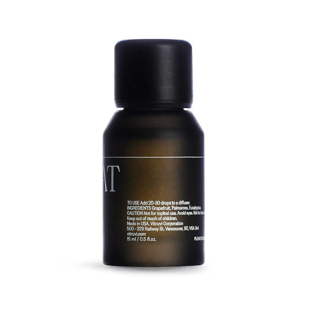 Vitruvi Retreat packaging and bottle on a clean vanity