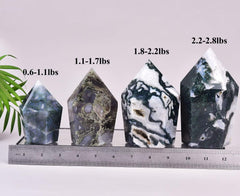 VIZYTOU moss agate obelisk close-up shows crystal texture and luster for display.