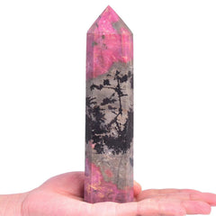 Close-up of VIZYTOU Rhodonite crystal shows pink hues and natural texture for focus