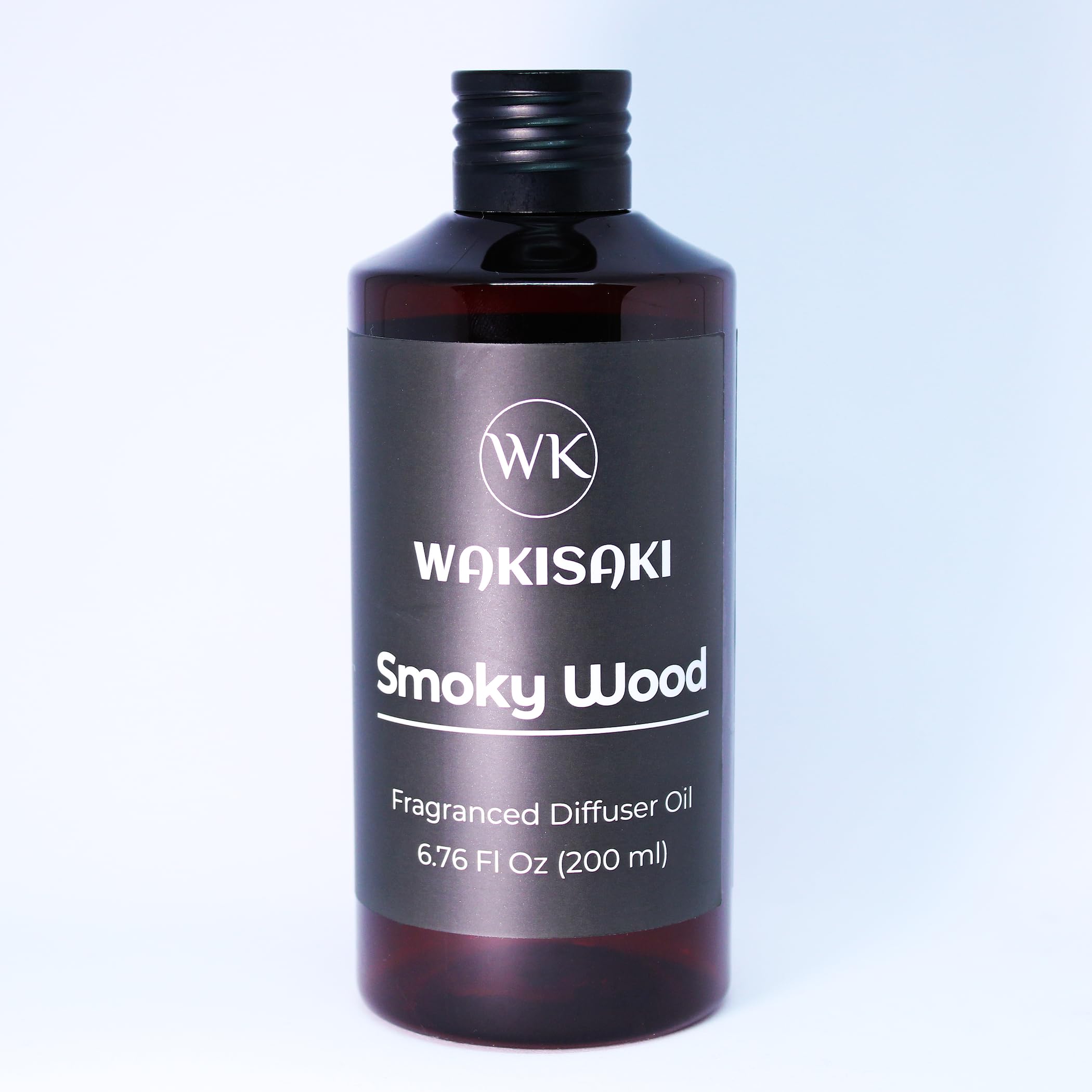 WAKISAKI Smoky Wood diffuser oil bottle for a calming space and lasting scent.