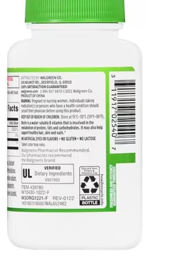 Daily-use Walgreens Biotin + Keratin tablets in a hands-on routine.