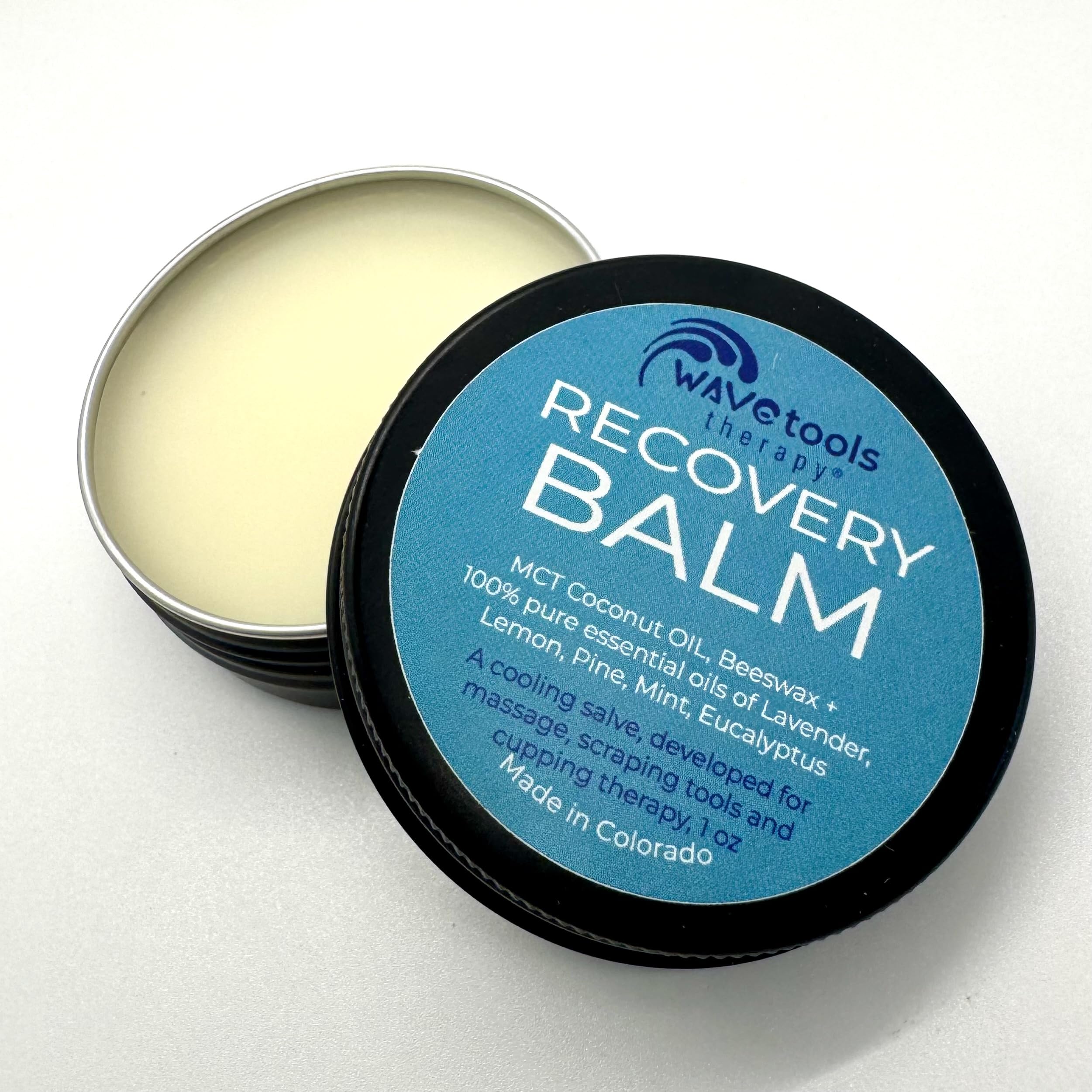 Wavetools Therapy recovery balm tin close-up for massage sessions.