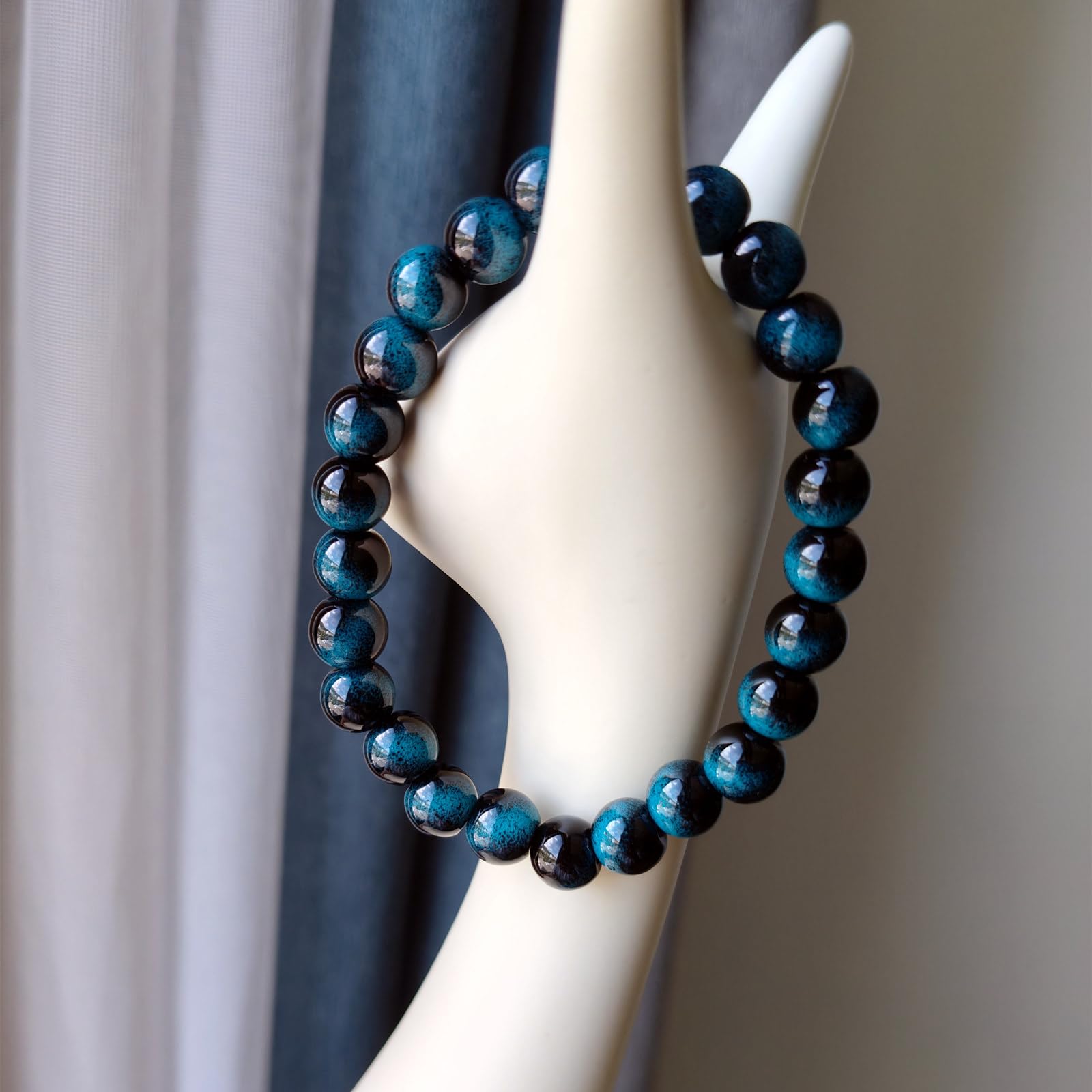 WEFRIN Evil Eye bracelet detail emphasizes hematite and tiger eye contrast.