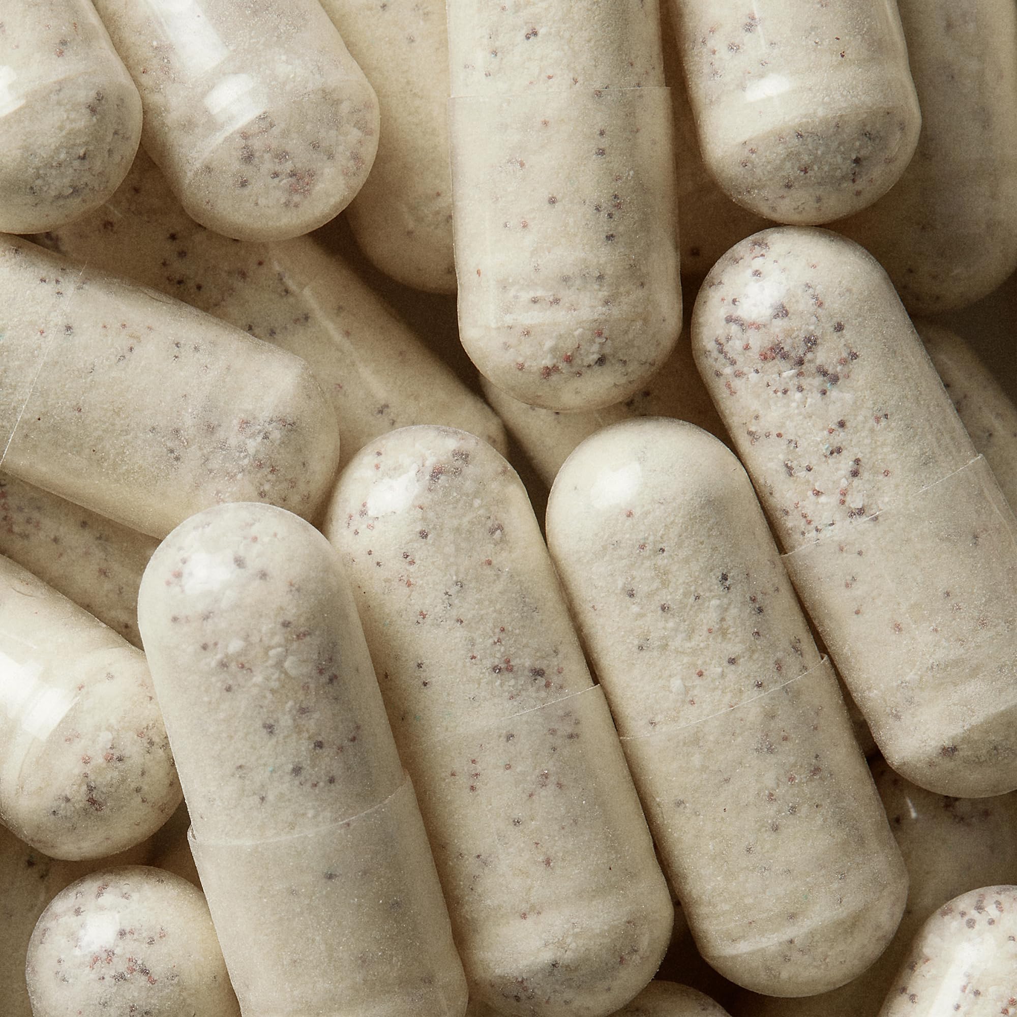 Close-up of WELLBEL Men capsules offering a convenient three-capsule daily dose